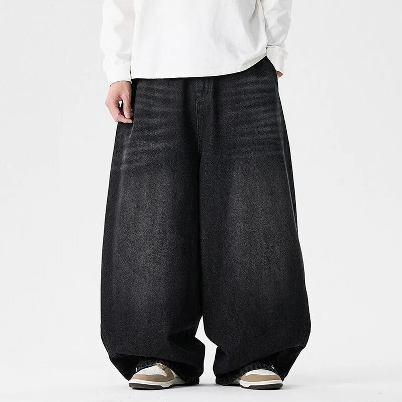 Men's plus size light blue wide leg baggy jeans on a hanger