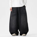 Men's plus size light blue wide leg baggy jeans on a hanger