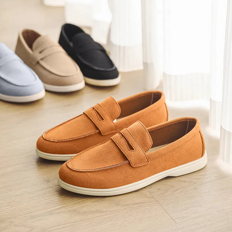 Men's suede leather slip-on casual shoe in a solid colour with a round toe and low flat heel.