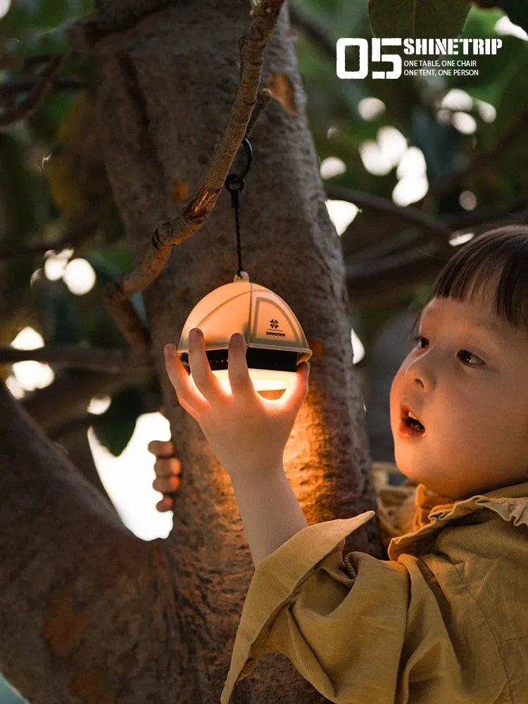 Camping tent light with analog brightness dial in dark green colour, showing compact dimensions
