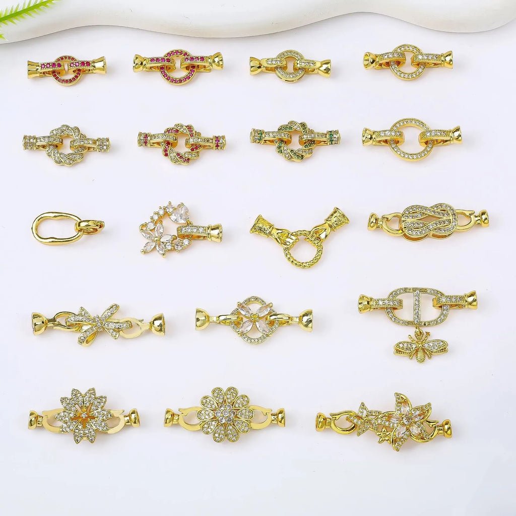 Small gold-plated necklace chain buckle on a white background, a DIY jewellery finding.