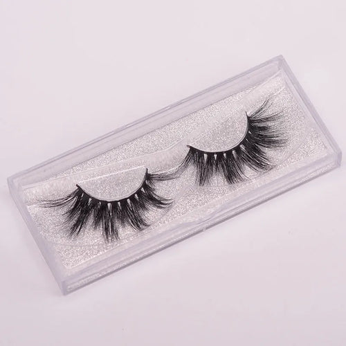 A pair of Affectionate brand 5D false eyelashes made from mink hair, shown with a storage cap and double-headed brush.