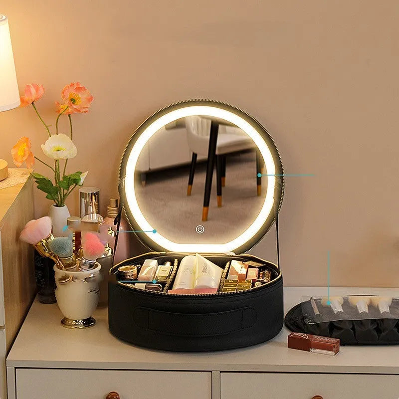 Round pink PU leather makeup bag with LED mirror open, showing internal partitions and carry strap.
