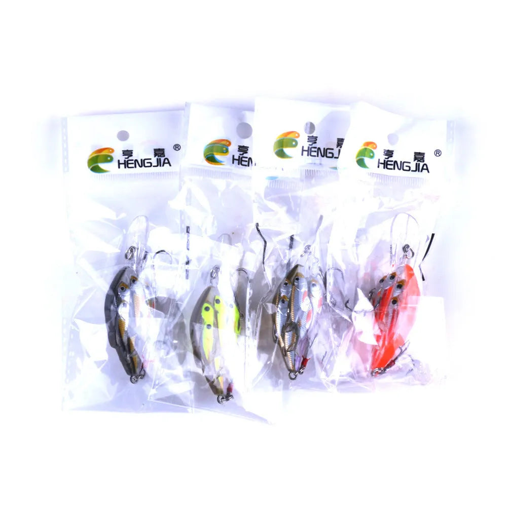 Sea fishing hard bait lure with feather hooks floating on water surface