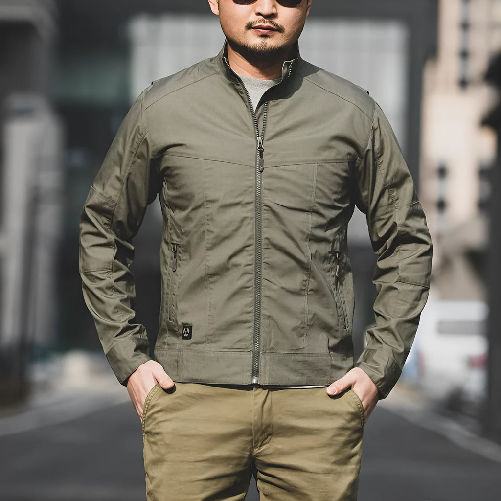 Man wearing a brown tactical camouflage polyester jacket with multiple pockets.