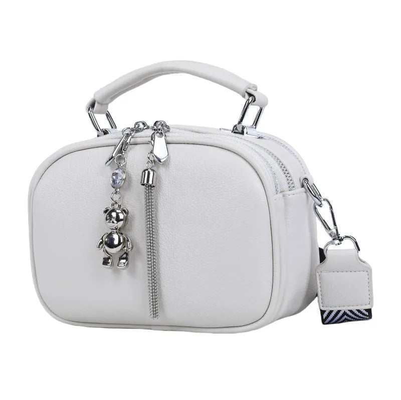 Women's small square stitching bag in PU material showing oval shape and double shoulder straps