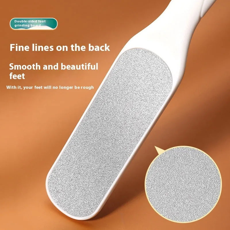 Stainless steel double-sided foot grinder tool with white and black abrasive units for manual foot care.