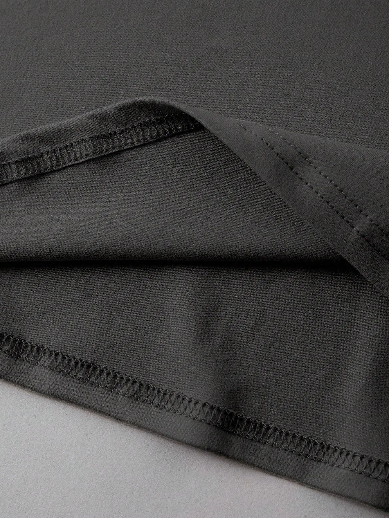 A loose-fitting unisex cotton T-shirt on a hanger, shown in one of its available colours.