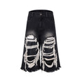 Black women's wide-leg cropped jeans with ripped patchwork details on cotton denim.