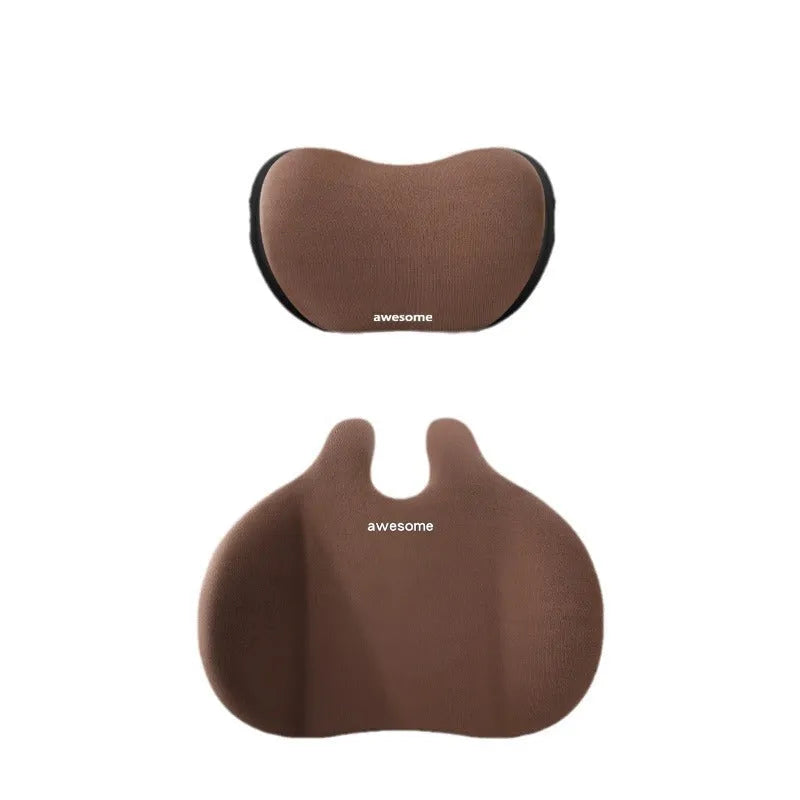 Black car headrest and lumbar support pillow set with cow head design pattern.