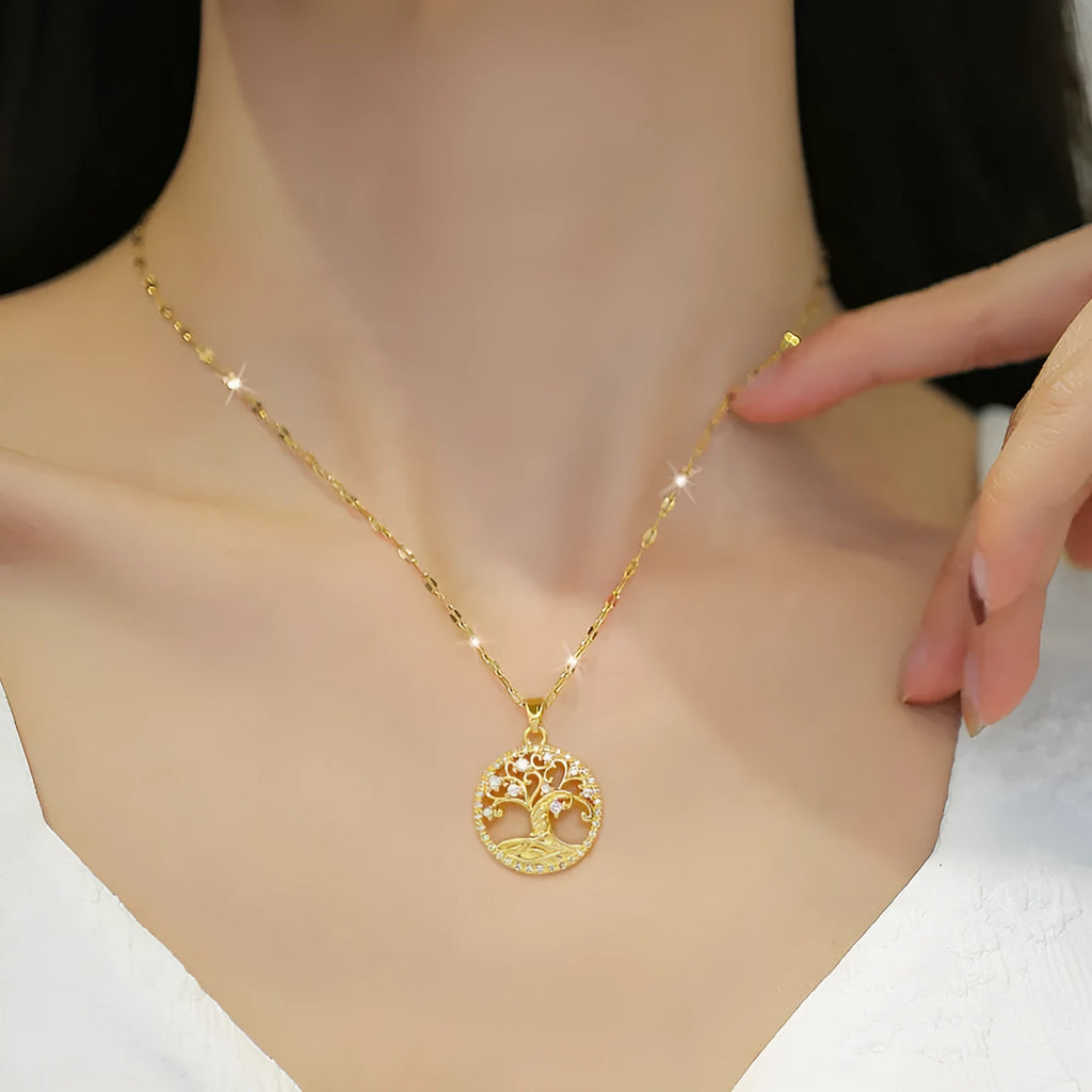 Gold-plated necklace with lucky tree rhinestone pendant and mother pearl centrepiece on an adjustable chain.