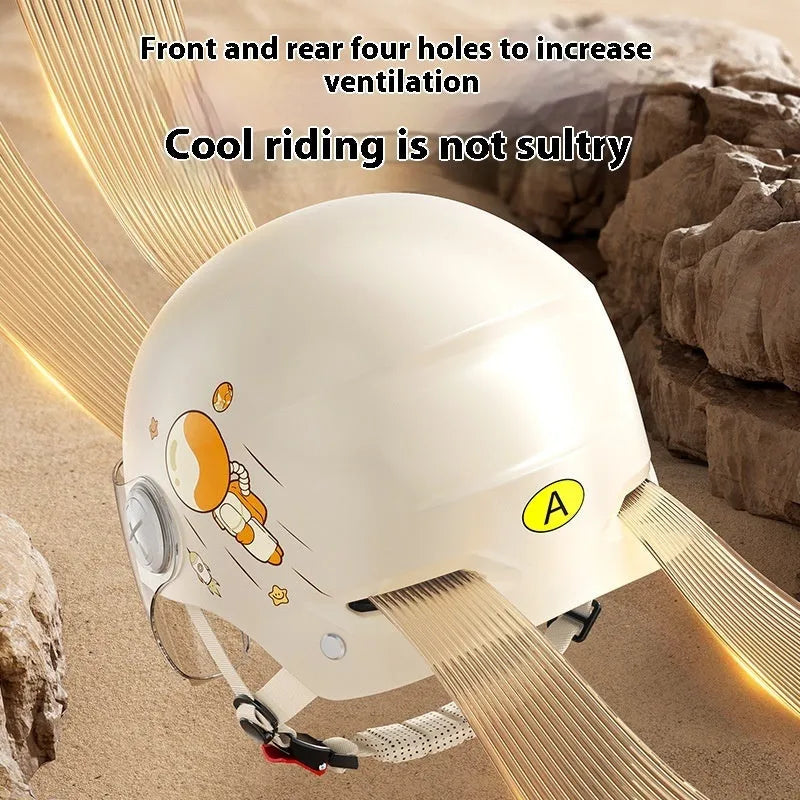 Khaki-coloured electric motorcycle half helmet with attached long glasses on a grey background.