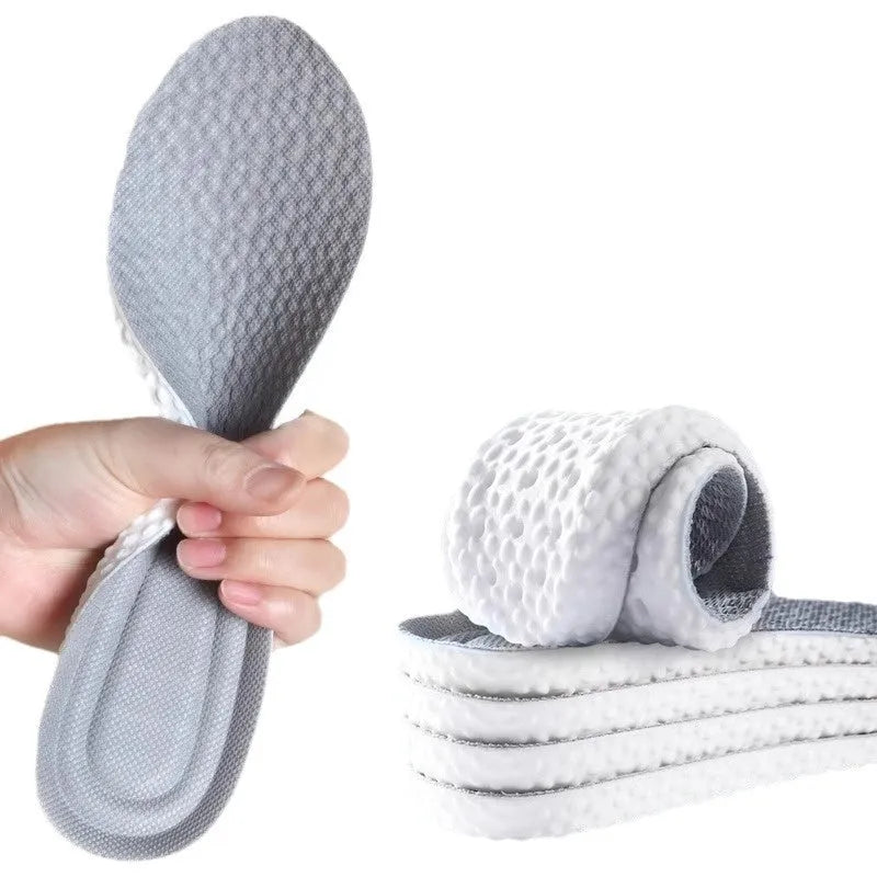 Grey, black, and orange breathable PU foam sports insoles laid flat, showing their cut-to-size design.