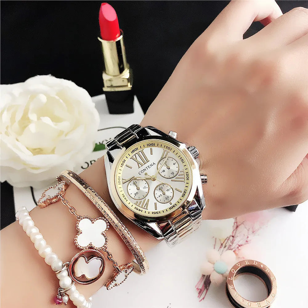 Women's silver rose gold quartz watch with diamond crystal mesh strap and analogue display.