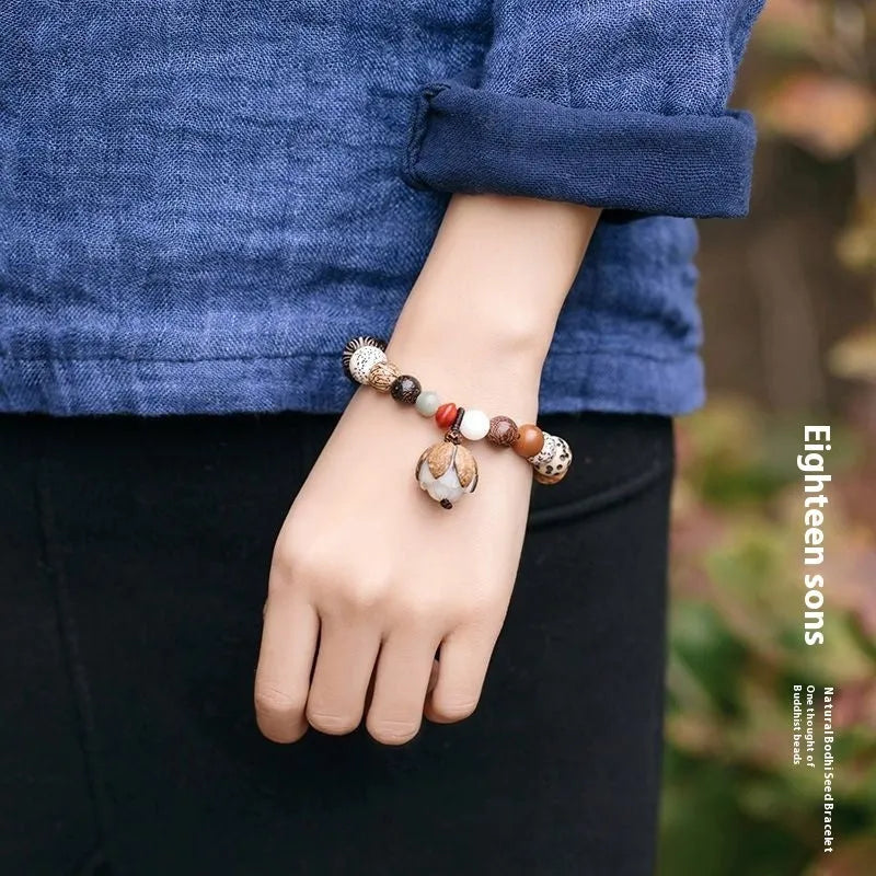 Handmade Bodhi seed bracelet with 18 natural beads in geometric pattern measuring 16cm