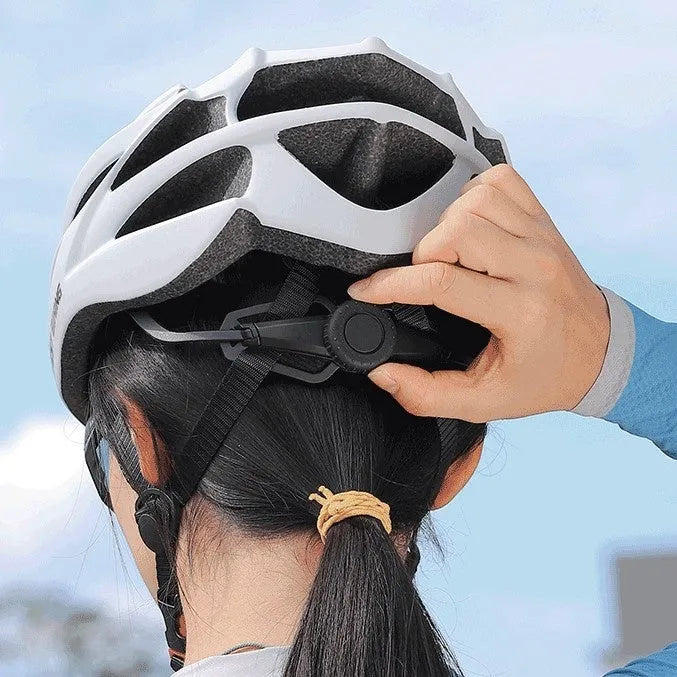 White bicycle helmet with integrated molding construction on display, size 54-62cm, PC and EPS materials