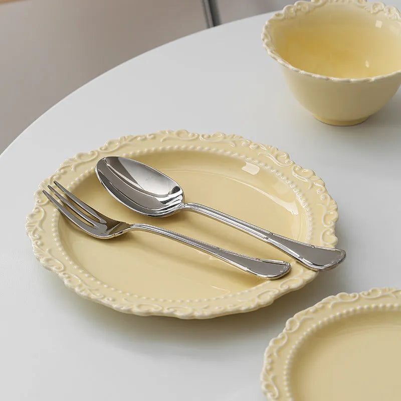 Cream ceramic lace vintage plate with irregular shape and coloured glaze, in white or yellow