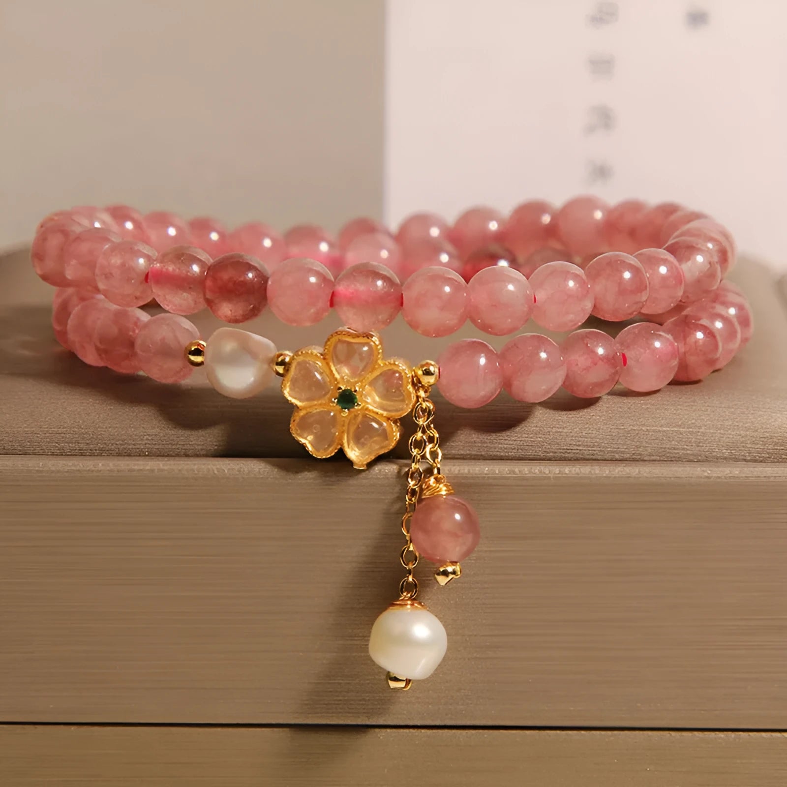 Women's twin ring bracelet with strawberry quartz four-leaf clover charms in Japanese Korean style