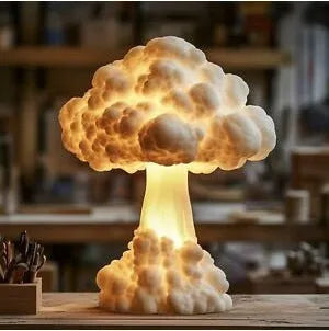 Modern art table lamp shaped like an atomic bomb mushroom cloud on a stand with USB cable.
