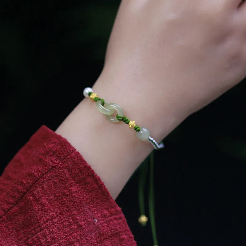Hetian jade woven bracelet with flexible wire construction and hollow out national tide design elements