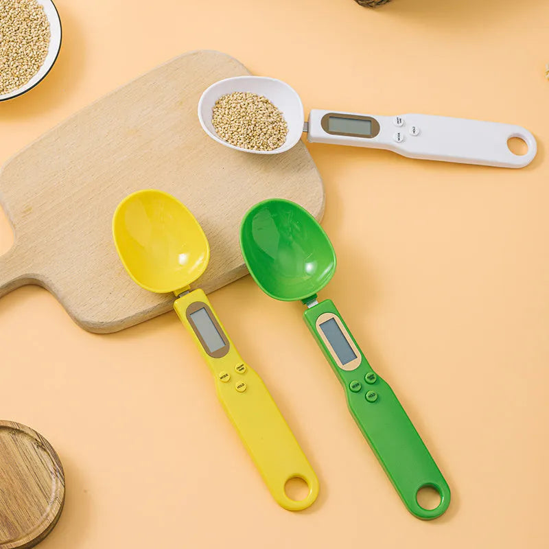 White digital spoon scale with LCD display showing weight measurement for kitchen ingredients