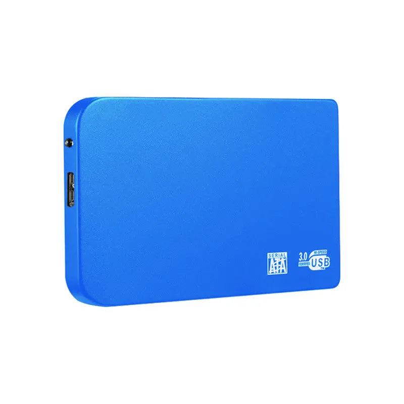 Silver portable solid state drive with USB cable and cover on a desk.