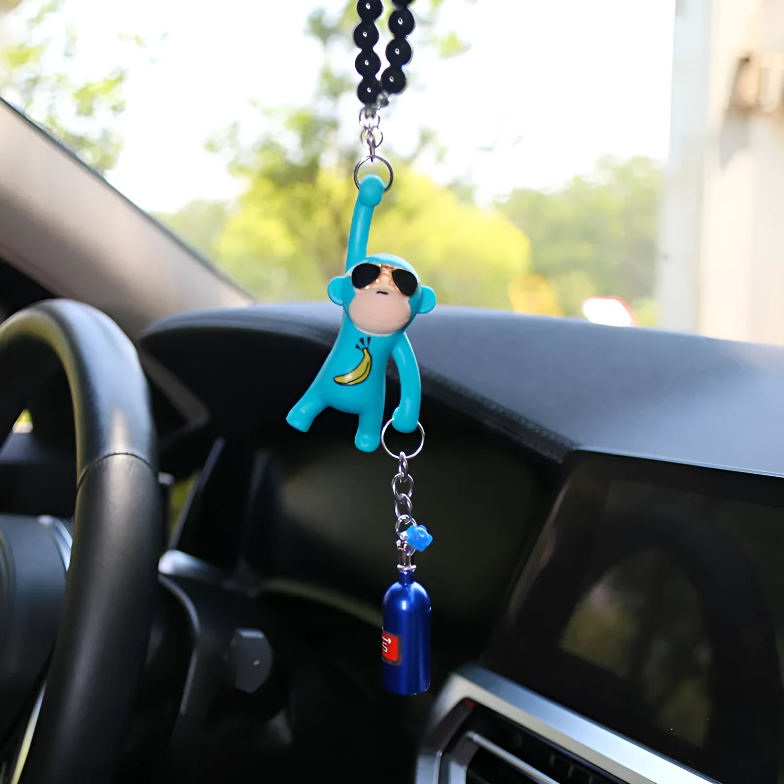 Cartoon monkey wearing sunglasses rearview mirror pendant on a bead necklace.