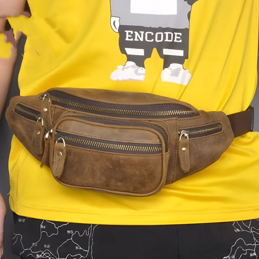 Brown leather shoulder messenger bag with a single strap and top flap closure.
