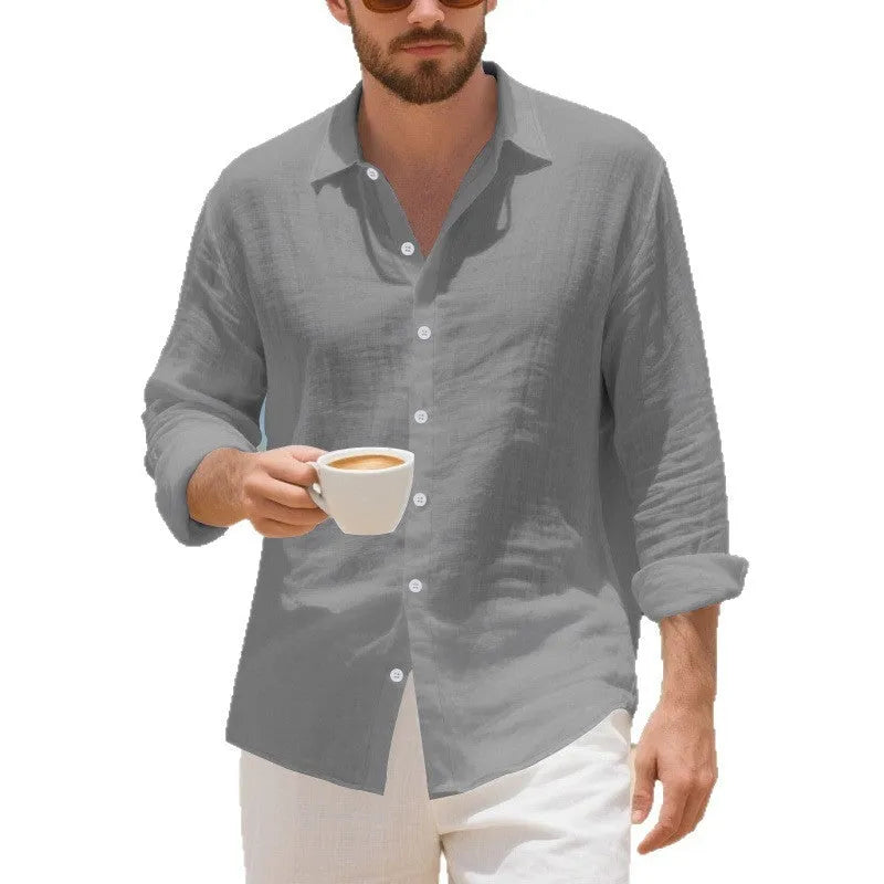 Linen Hawaiian casual shirt in a loose fit, shown in an earthy yellow colour on a hanger.