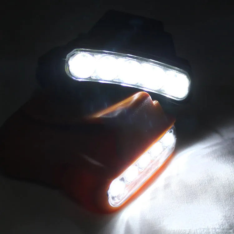 5LED ABS plastic cap lamp clipped to a cap brim, measuring 5x4.5cm, available in black or orange for outdoor use
