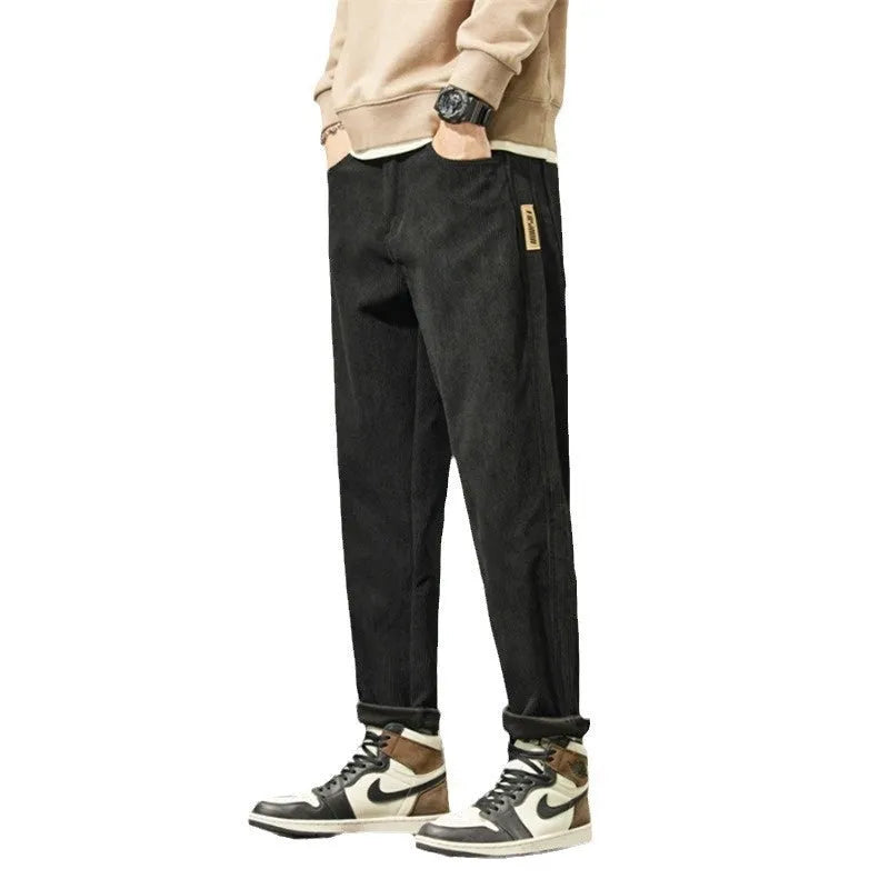 Corduroy men's casual trousers in street fashion style with straight leg opening and tapered cut