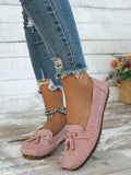 Women's apricot suede flat shoes with a bow detail on the front, showing round toe and low-top design.