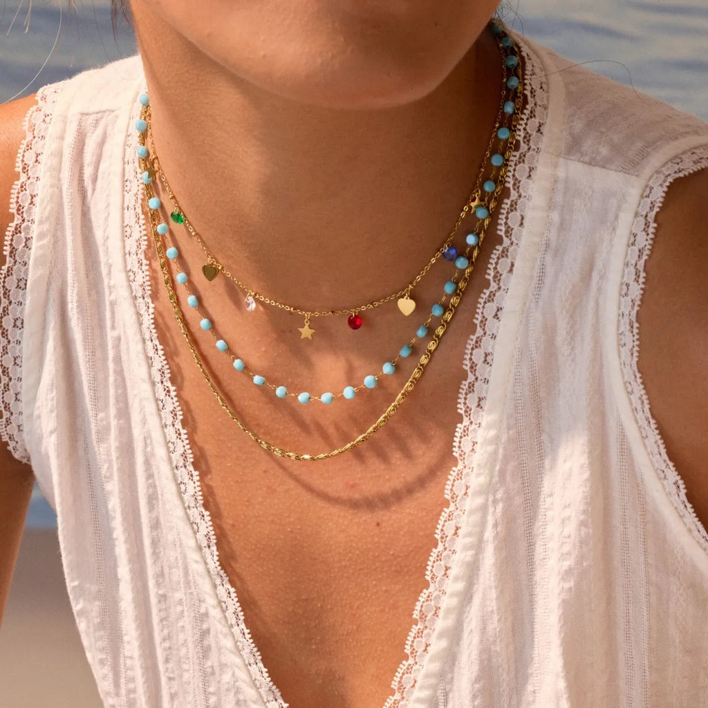 Gold-plated stainless steel double-layer necklace with colourful geometric beads on a white background
