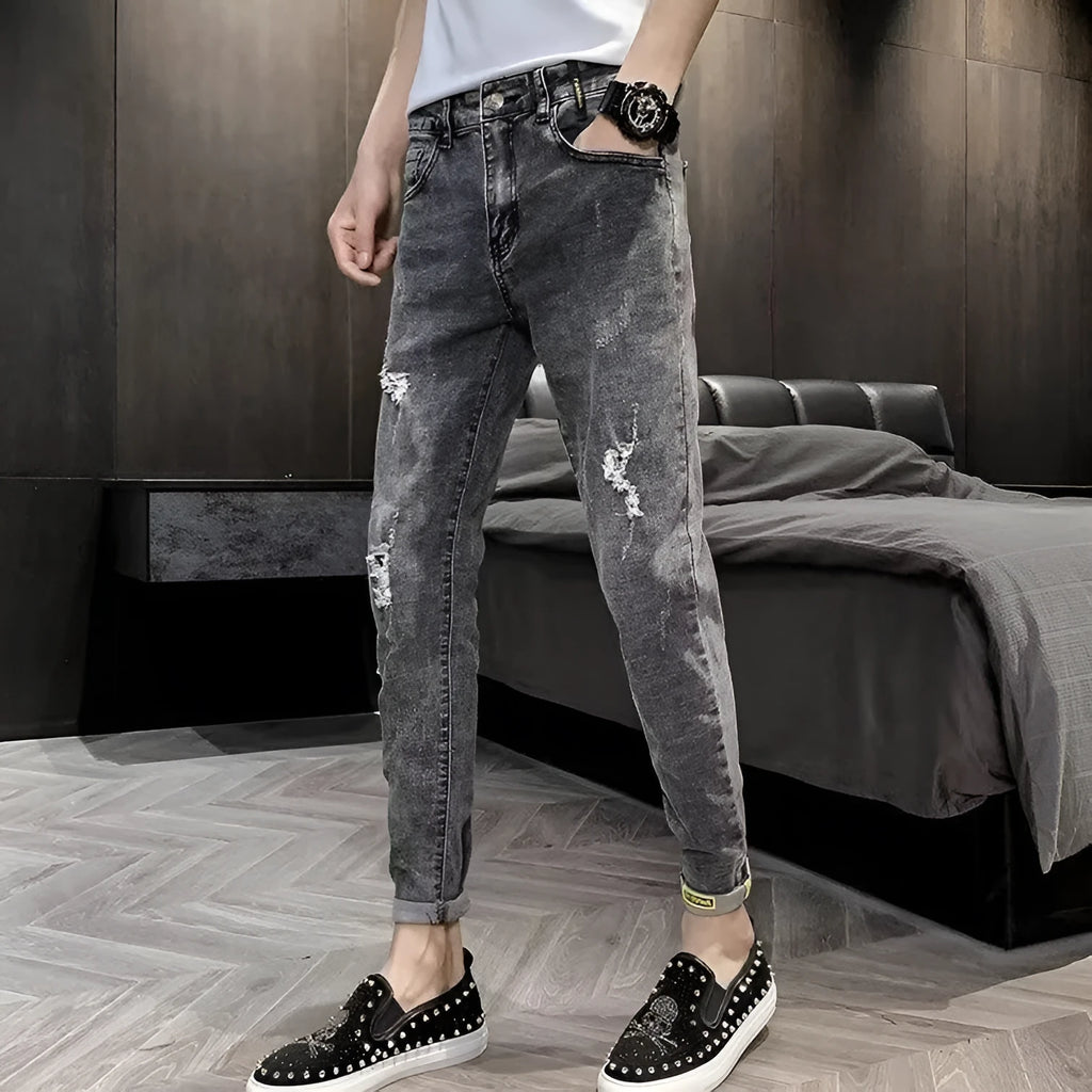 Men's blue denim jeans with high waist, button fly, and straight leg design on hanger