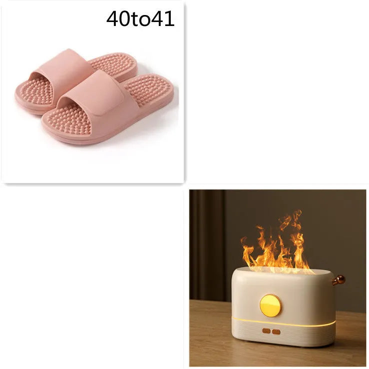Black USB humidifier with flame simulation effect on wooden desktop