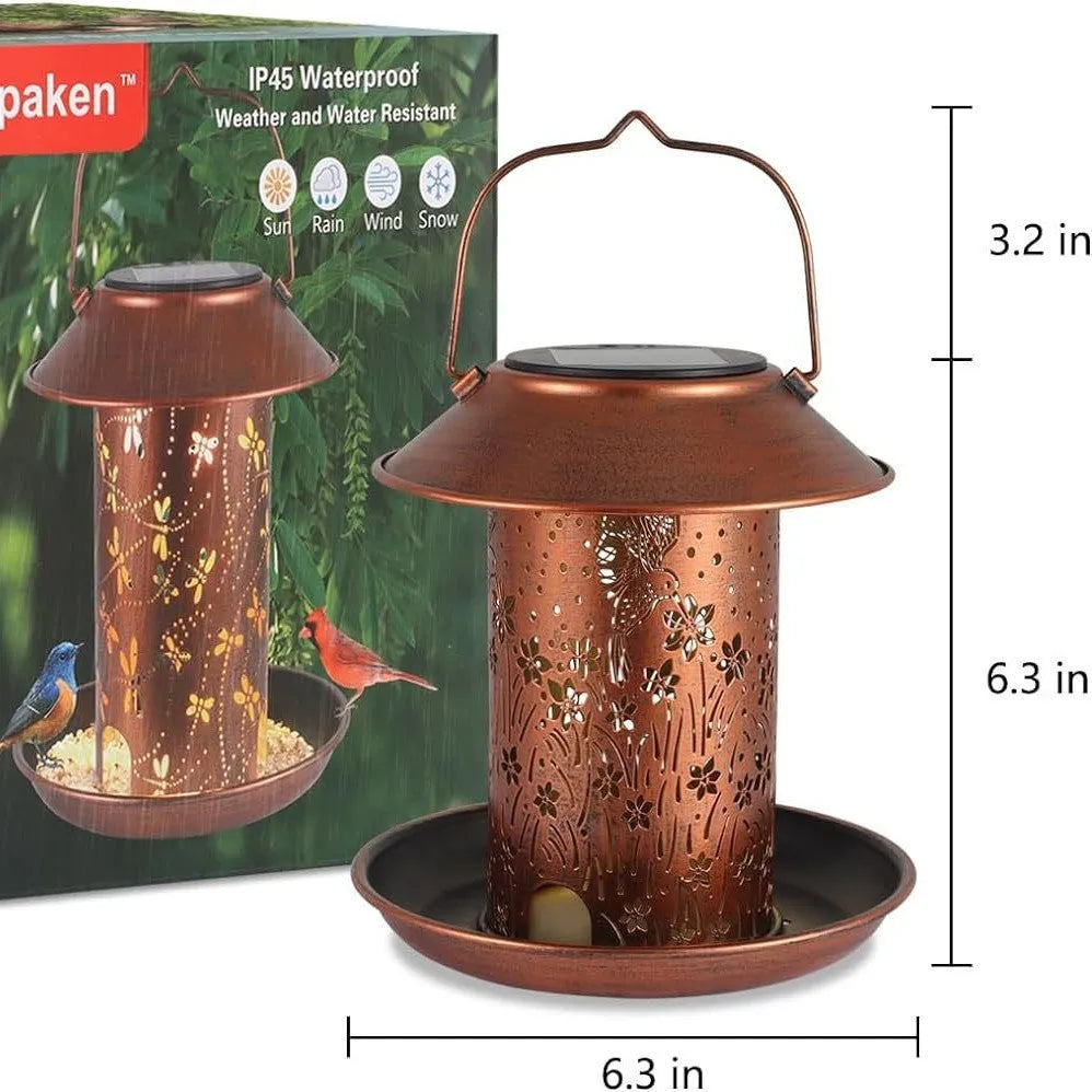 Solar-powered iron bird feeder with hummingbird pattern and built-in LED lamp for outdoor garden use