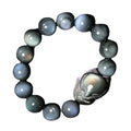 Obsidian stone bracelet with carved fox design on a central bead, shown in multiple size options.