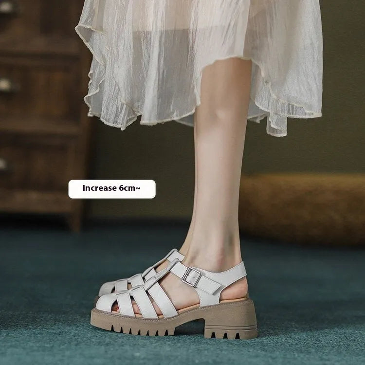 Women's black retro platform sandals with closed toe, hollow sides, chunky heel, and a buckle fastening.