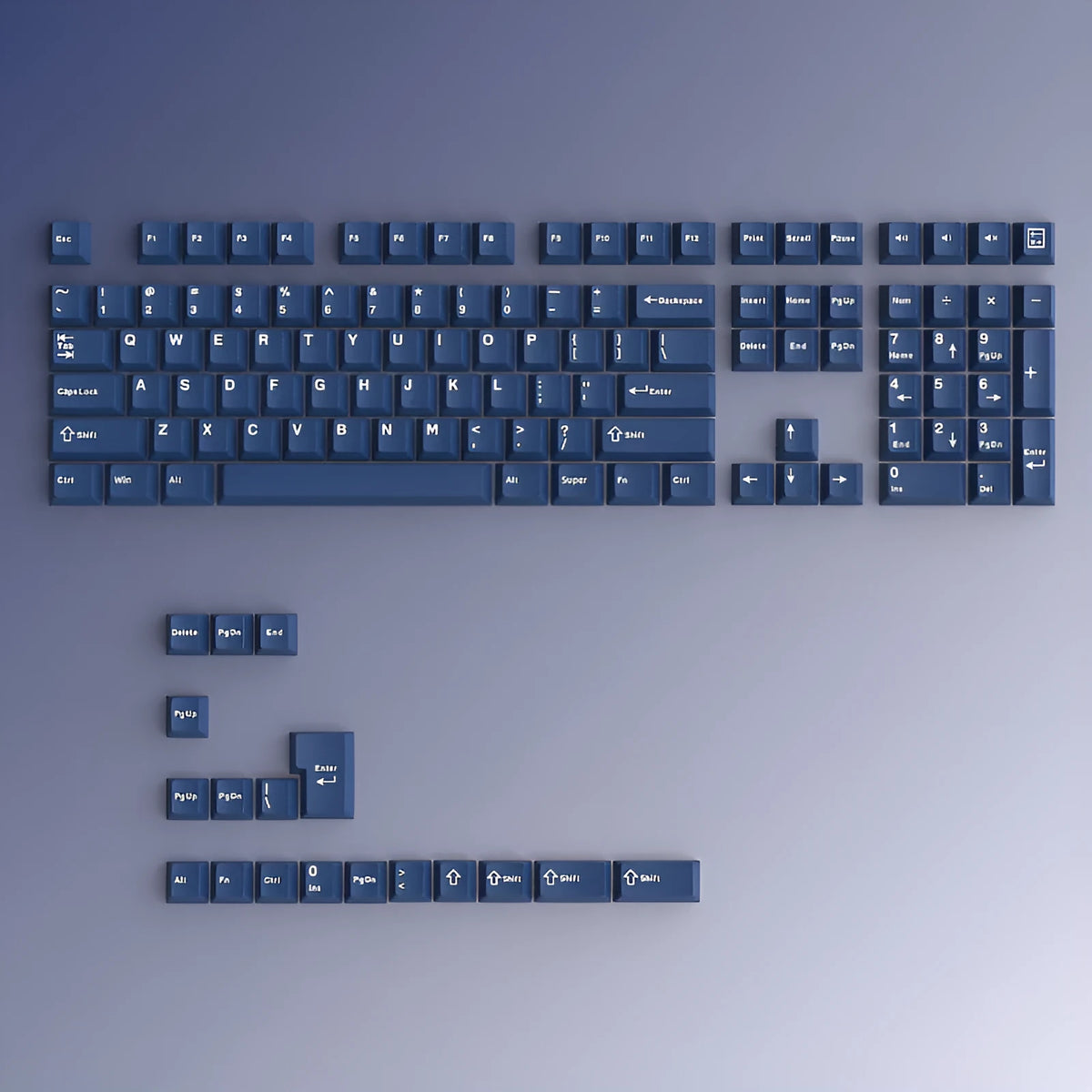 PBT two-tone blue key cap set with carved height profile, measuring 27cm x 17cm x 3cm