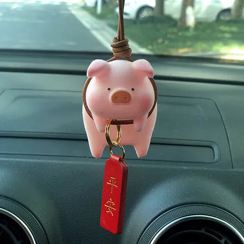 Set of eight cute cartoon pig resin car dashboard decorations on a car console