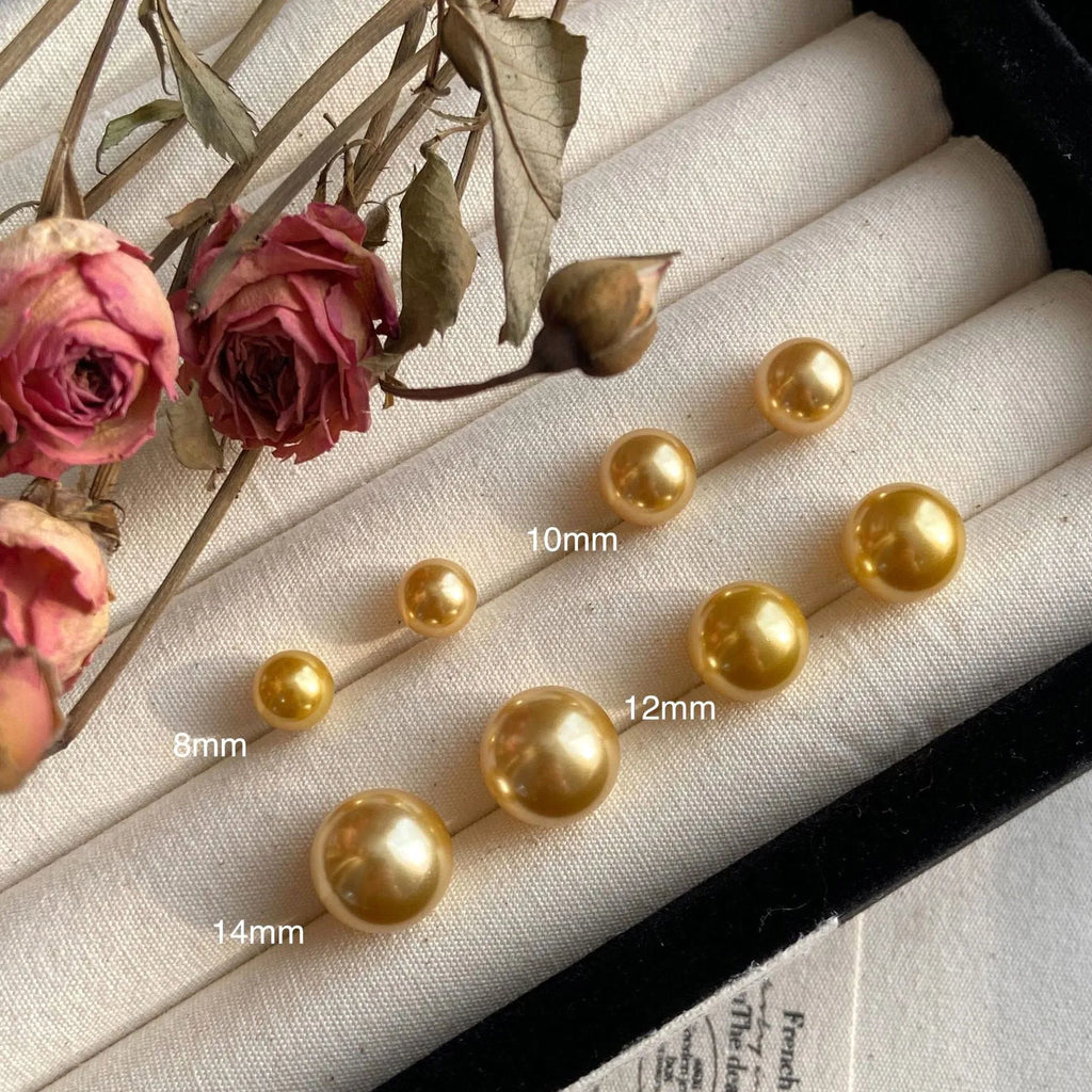 Women's geometric pearl stud earrings with silver settings and retro styling