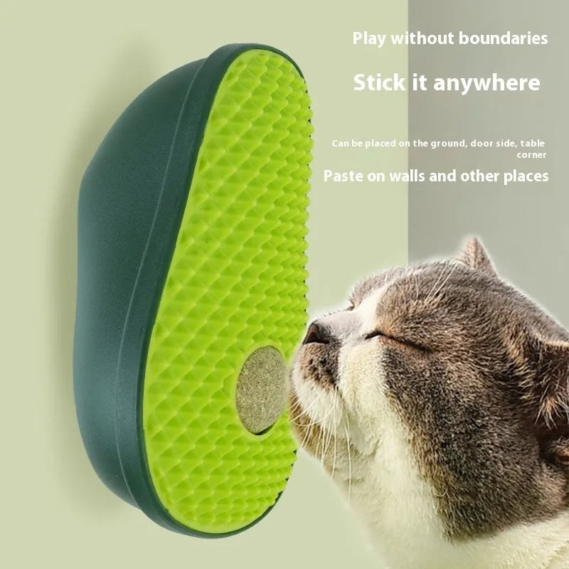 Green avocado-shaped cat scratching post toy on a white background