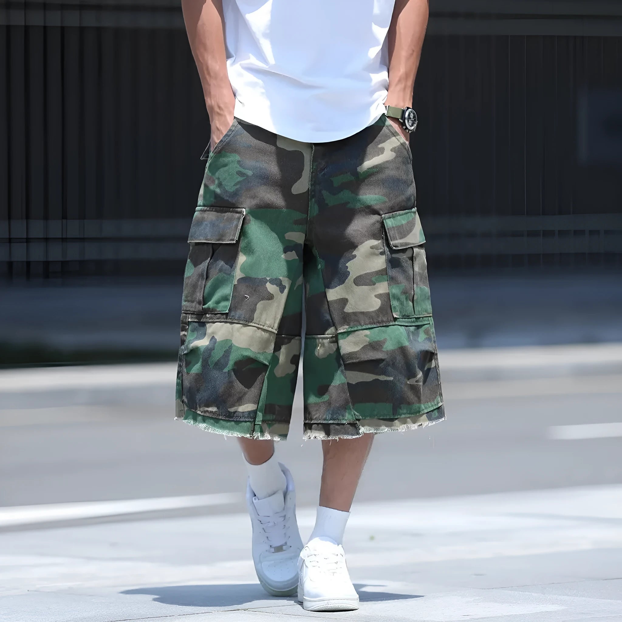 Loose-fit cotton camouflage shorts in retro workwear style on a plain background.