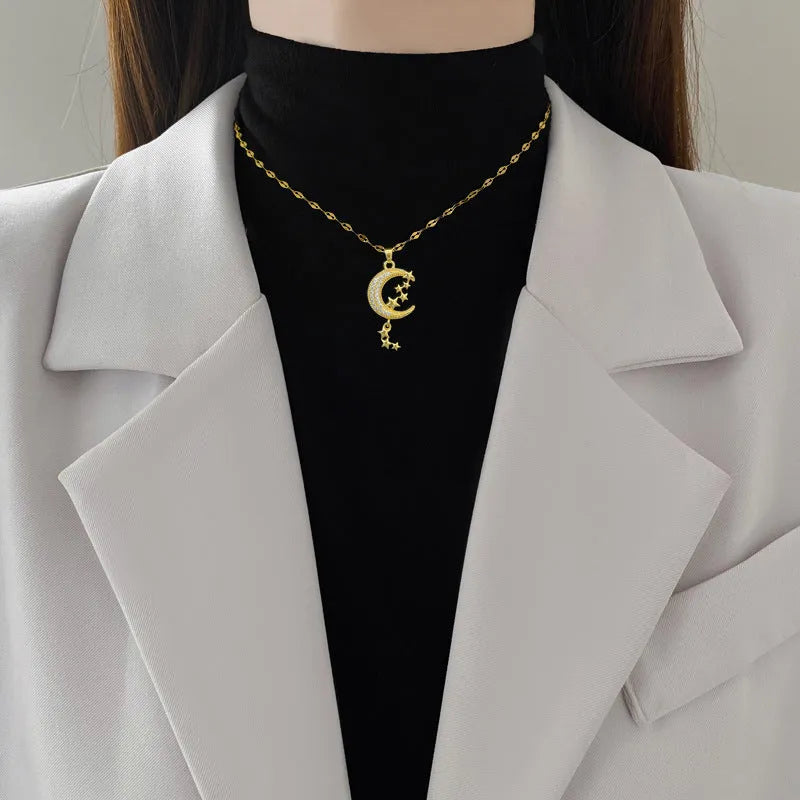 Stainless steel necklace with a copper moon pendant featuring a full diamond pattern design.