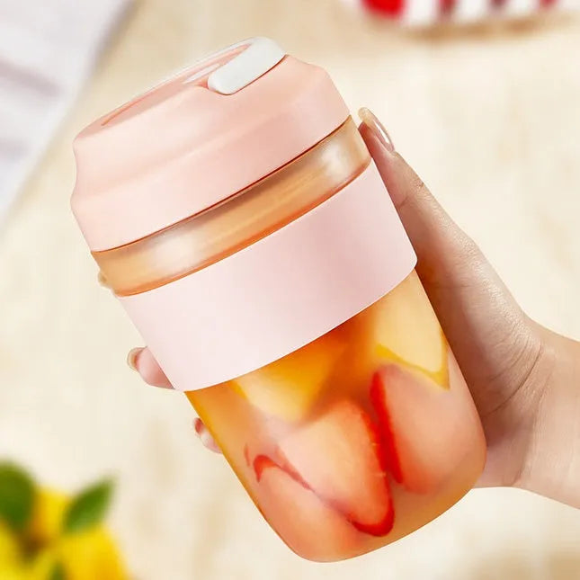 Portable rechargeable blender juicer cup 400ml capacity with four stainless steel blades in purple, green, and orange colour options