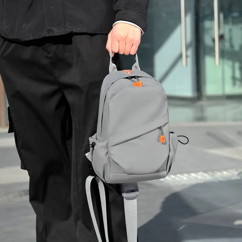 Mens black casual crossbody bag with single shoulder strap, made from waterproof polyester