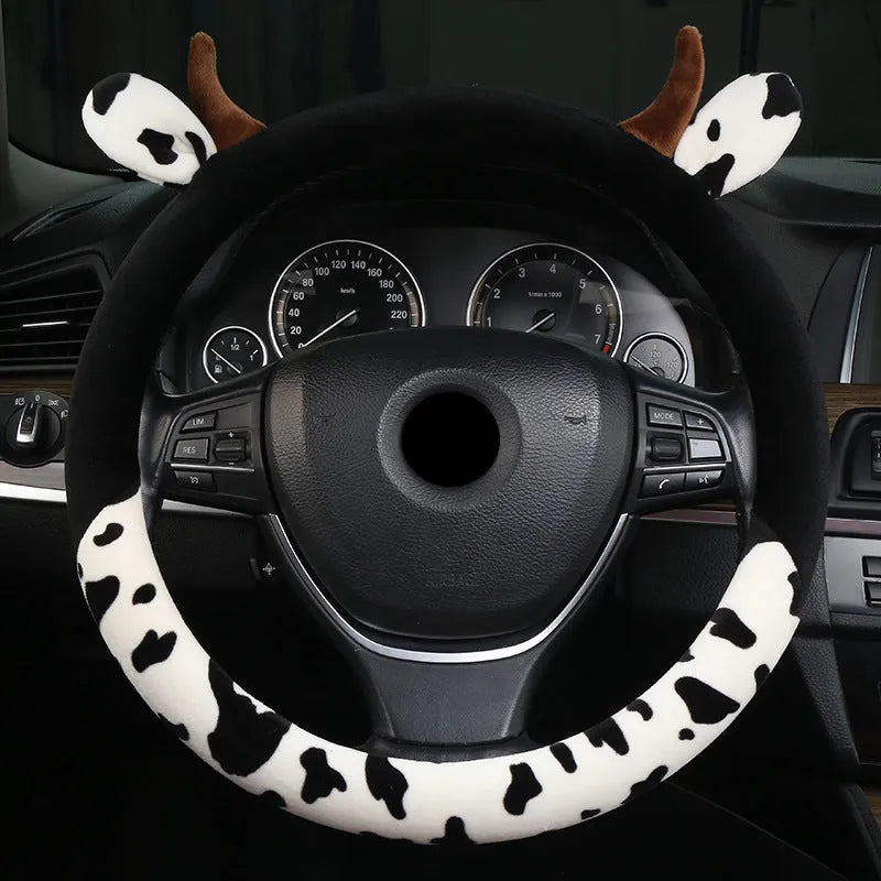 Black short plush automotive steering wheel cover showing protective handle feature