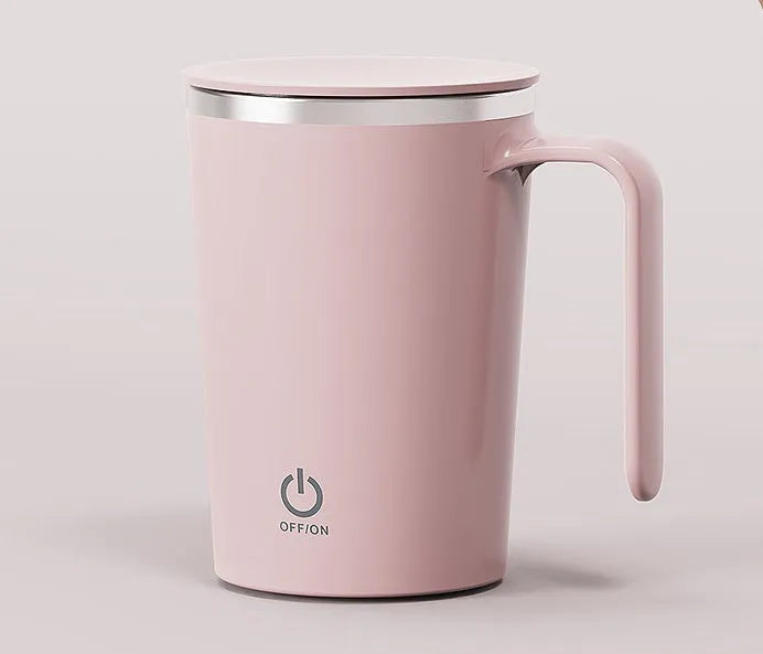 White automatic electric mixing cup with USB cable on a table.