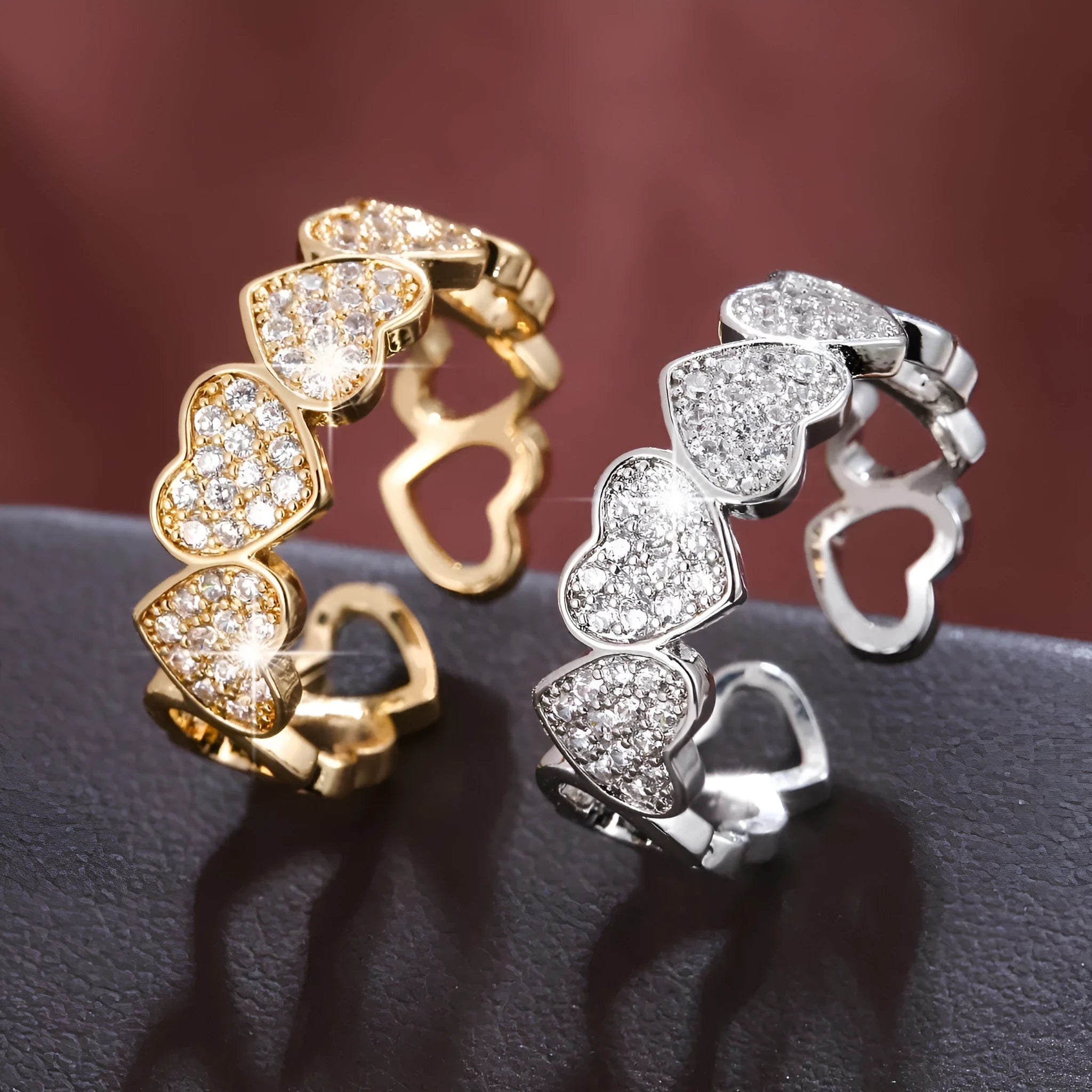 Adjustable copper fashion ring with a heart design, shown in gold and silver colour options.