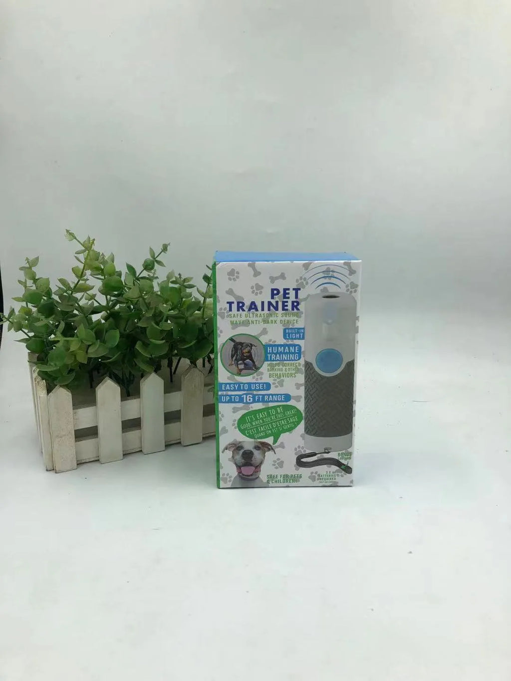 White handheld ultrasonic dog bark control trainer with ABS plastic housing
